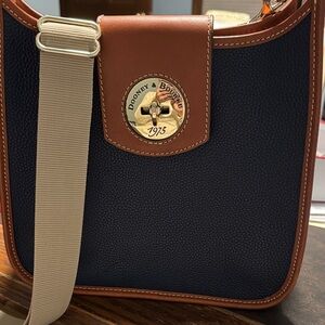 Dooney and Bourke turn lock messenger bag in midnight blue